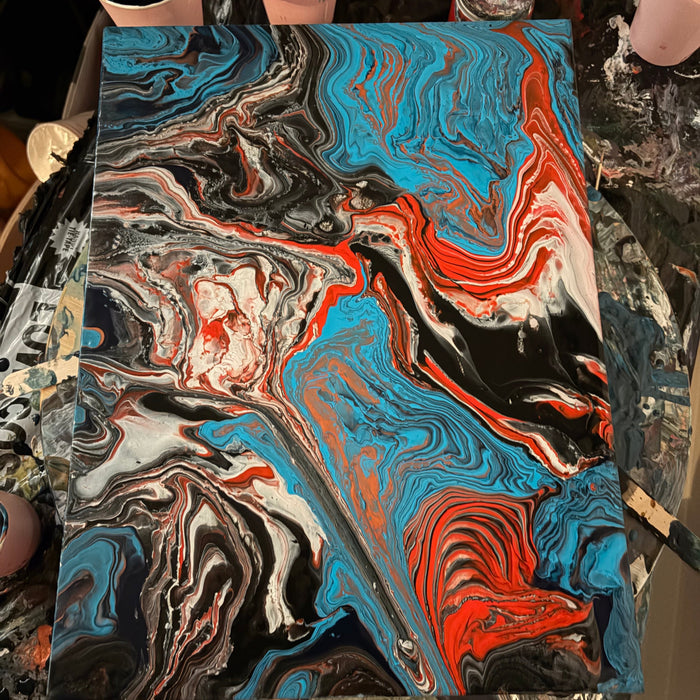 Blue, red, black and white acrylic pour painting with cells, made by a Handy Mandy customer