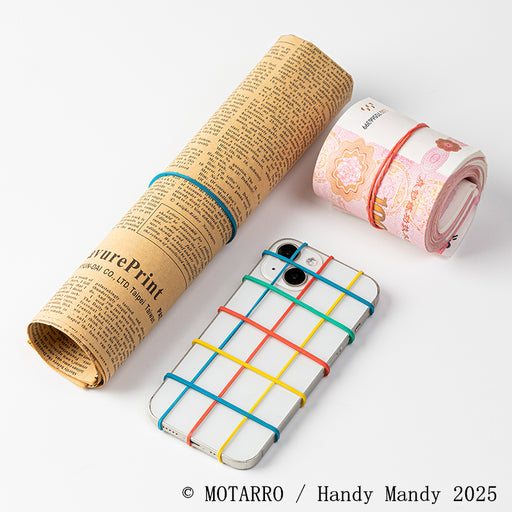 Elastic bands securing newspaper, money roll and smartphone