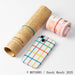 Elastic bands securing newspaper, money roll and smartphone